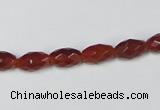 CAA124 15.5 inches 6*10mm faceted rice red agate gemstone beads