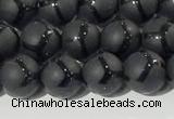 CAA3655 15.5 inches 6mm round matte & carved black agate beads