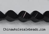 CAB336 15.5 inches 10*14mm faceted & twisted rice black agate beads
