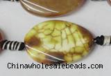 CAG1578 15.5 inches 20*30mm twisted oval fire crackle agate beads