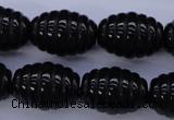 CAG1693 15.5 inches 15*20mm carved rice black agate beads