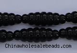 CAG1695 15.5 inches 10*30mm carved rice black agate beads