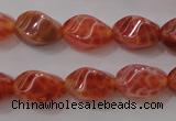 CAG4184 15.5 inches 6*10mm twisted rice natural fire agate beads