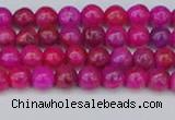 CAG9924 15.5 inches 4mm round fuchsia crazy lace agate beads