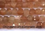 CCU885 15 inches 4mm faceted cube sunstone beads