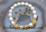 CFB928 9mm - 10mm rice white freshwater pearl & honey jade stretchy bracelet