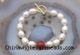 CFB974 Hand-knotted 9mm - 10mm rice white freshwater pearl & red agate bracelet