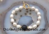 CFB978 Hand-knotted 9mm - 10mm rice white freshwater pearl & black lava bracelet