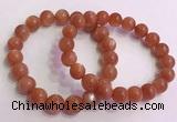 CGB4540 7.5 inches 10mm - 11mm round golden sunstone beaded bracelets