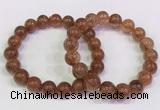 CGB4621 10mm - 11mm round golden rutilated quartz beaded bracelets