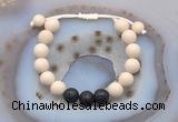 CGB6670 10mm round white fossil jasper & black lava adjustable bracelets