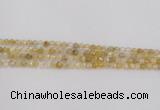 CRU666 15.5 inches 4mm faceted round golden rutilated quartz beads