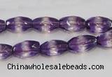 CSA25 15.5 inches 7*12mm faceted rice synthetic amethyst beads