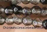 CTG2506 15.5 inches 4mm faceted round smoky quartz beads